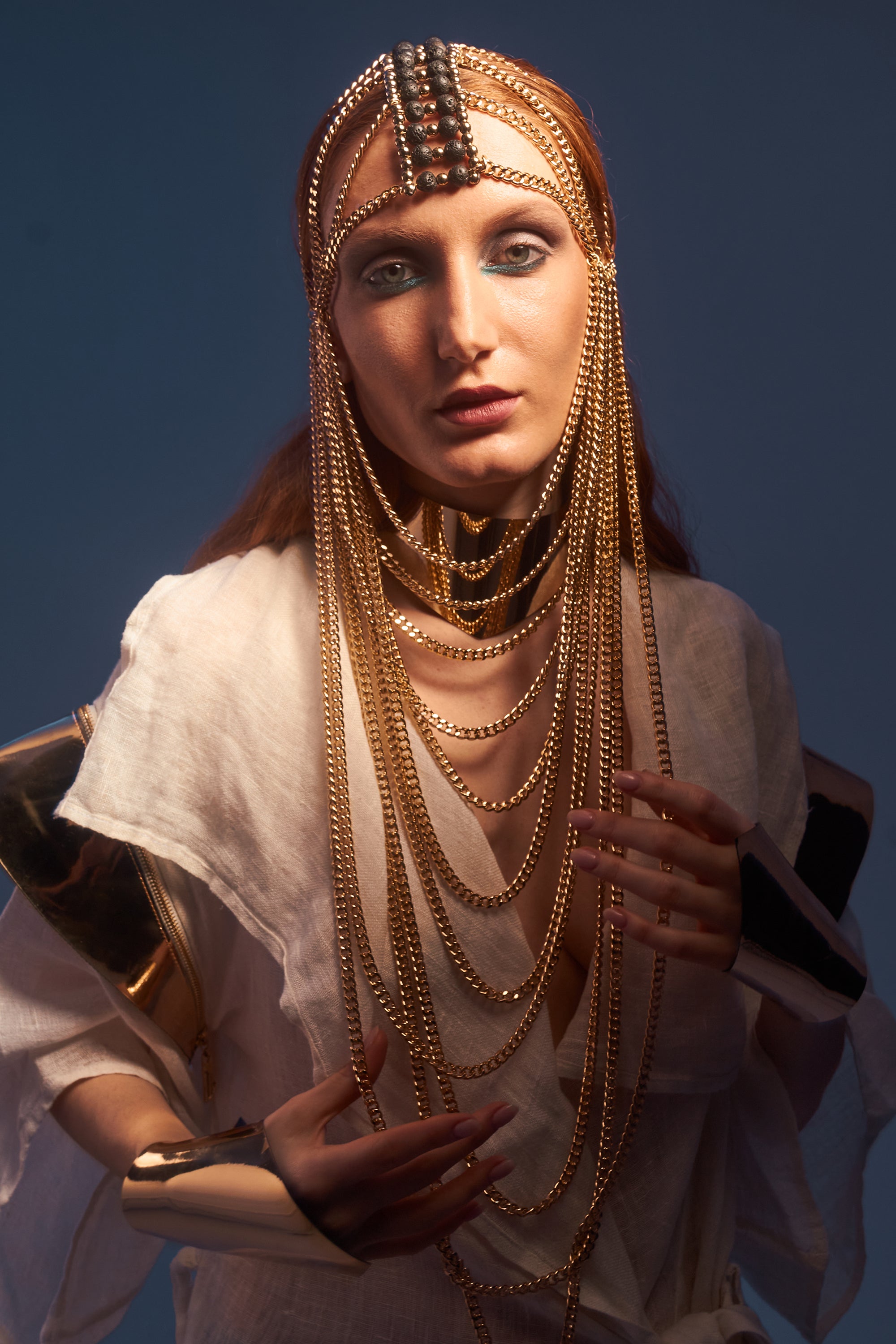 Gold chain mask with lava stone