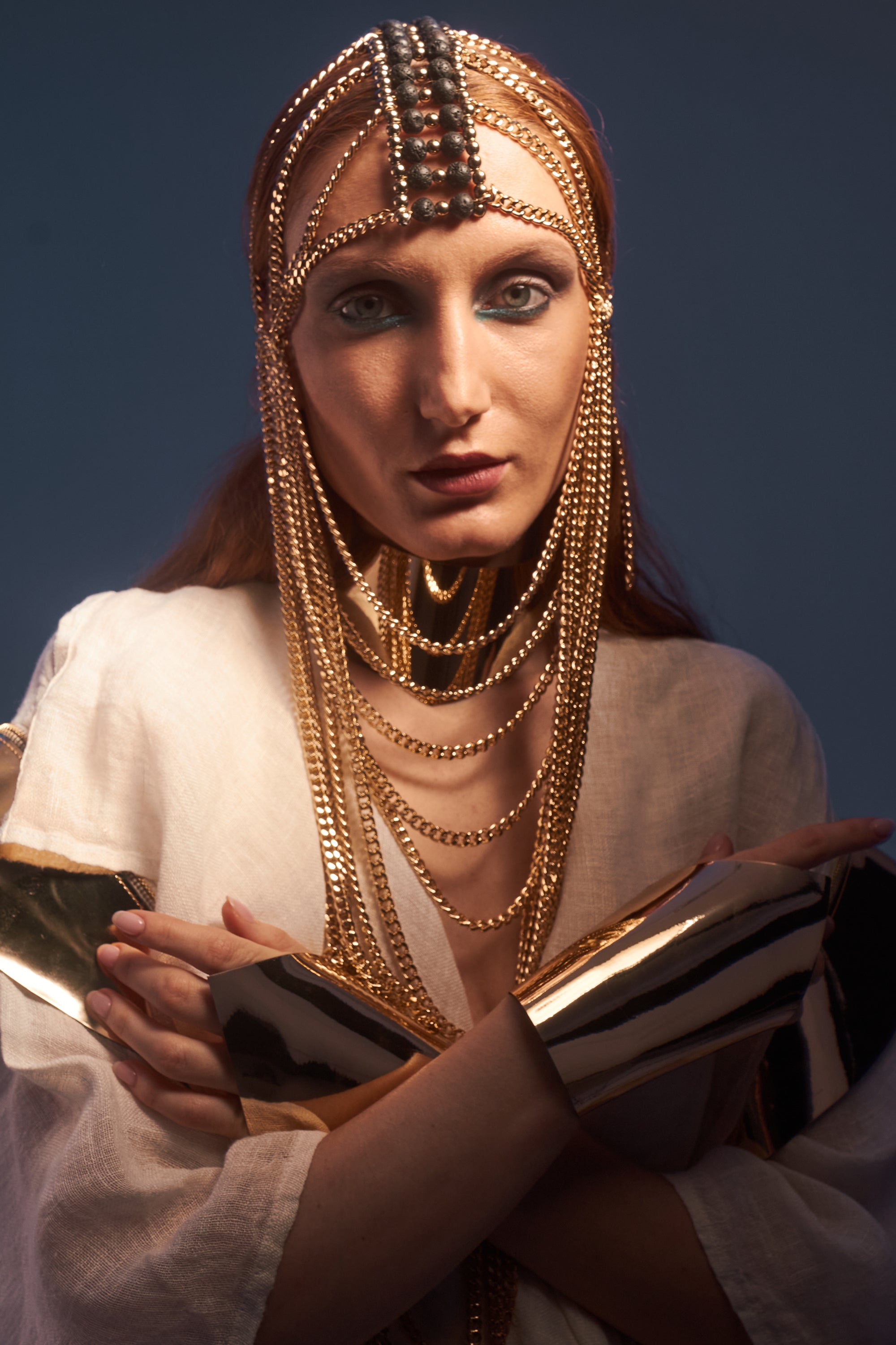 Gold chain mask with lava stone