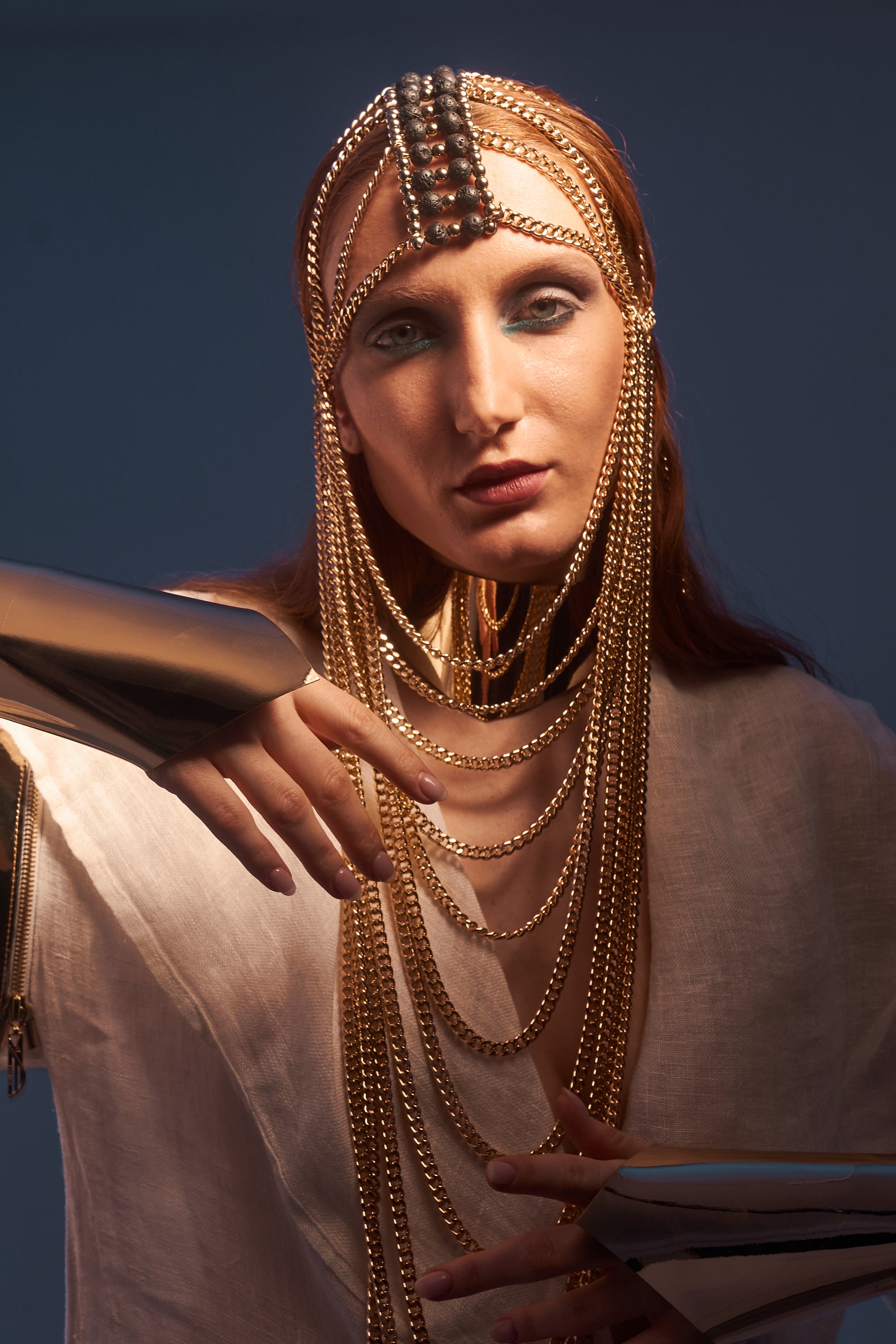 Gold chain mask with lava stone