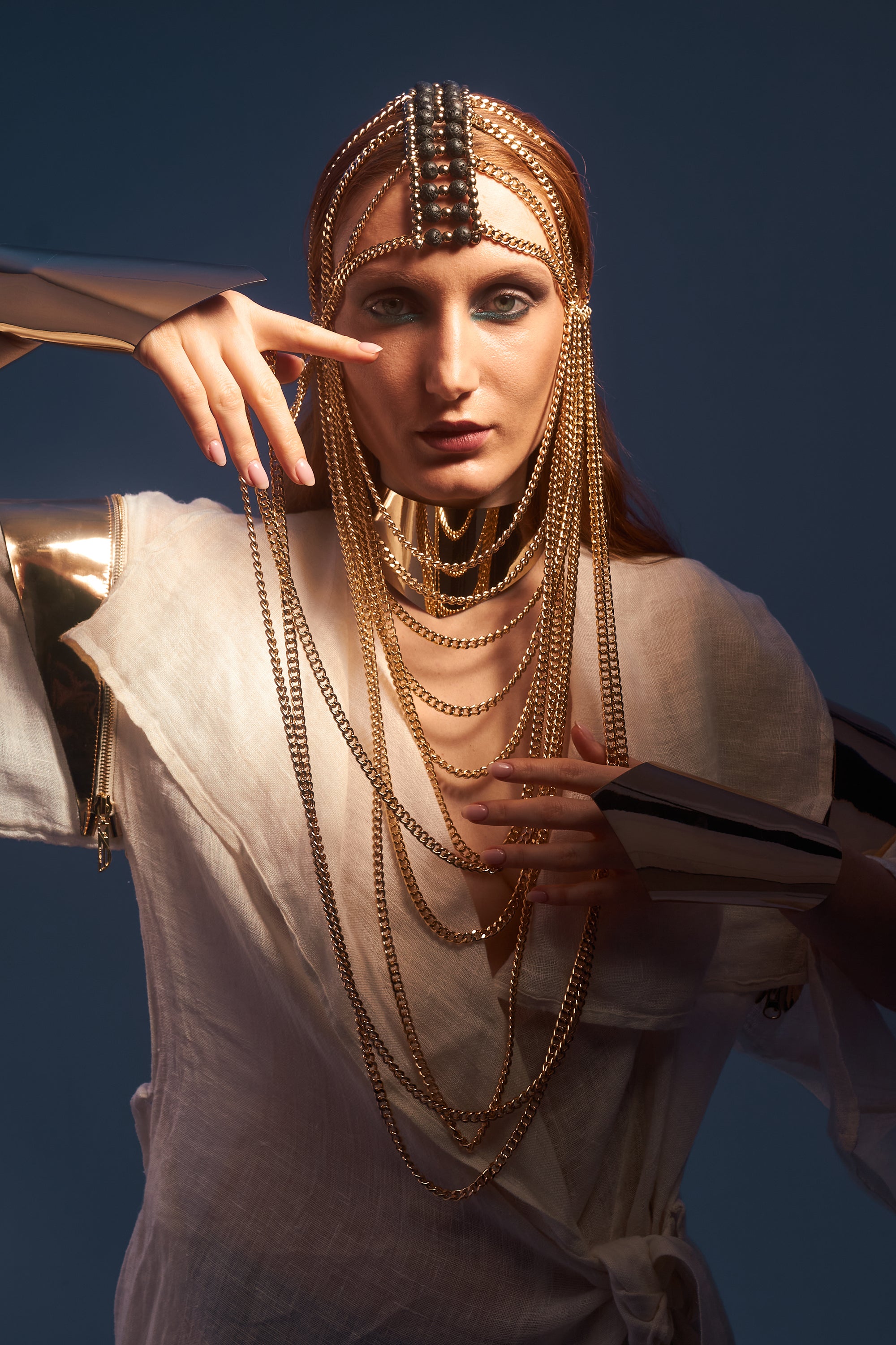 Gold chain mask with lava stone