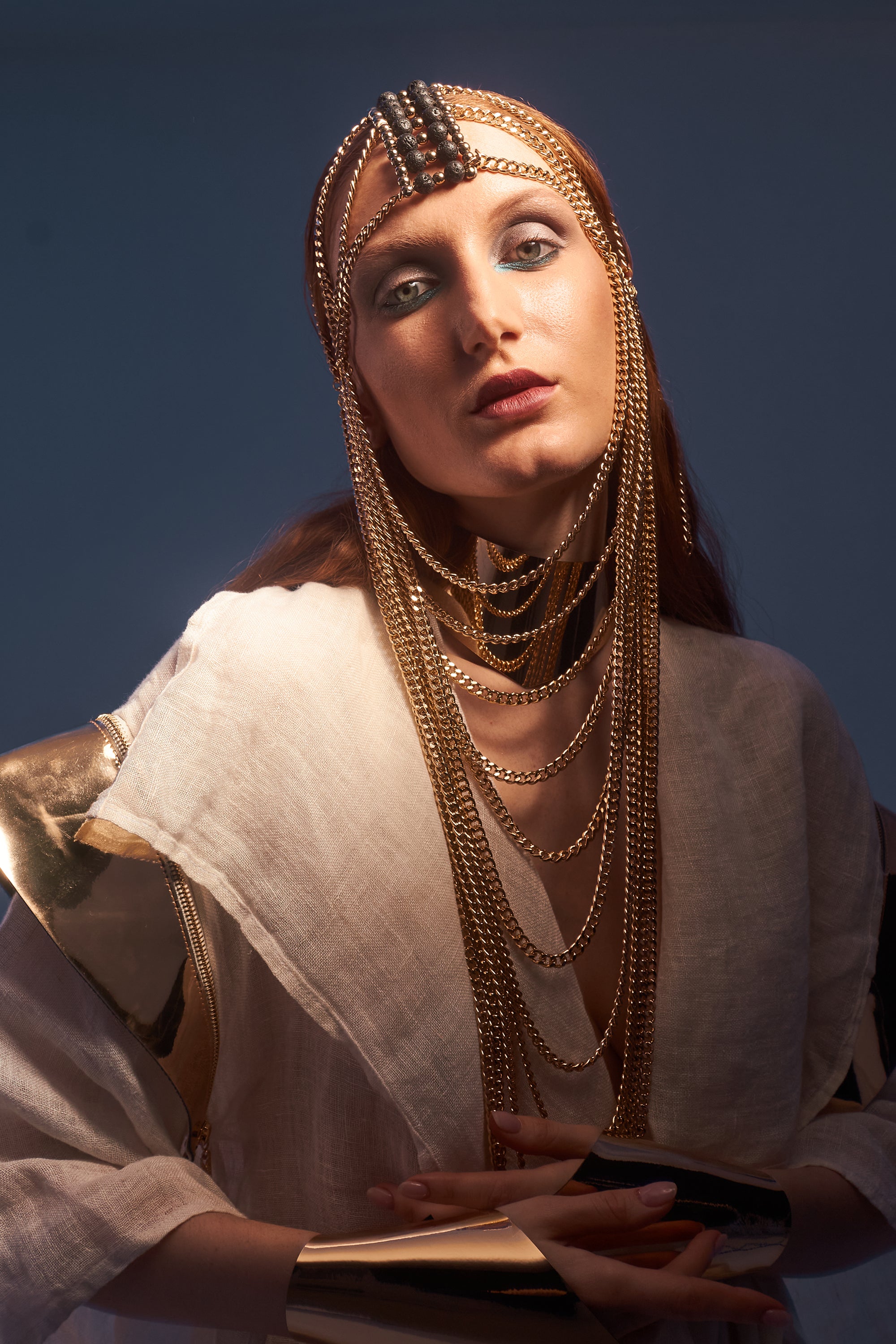 Gold chain mask with lava stone