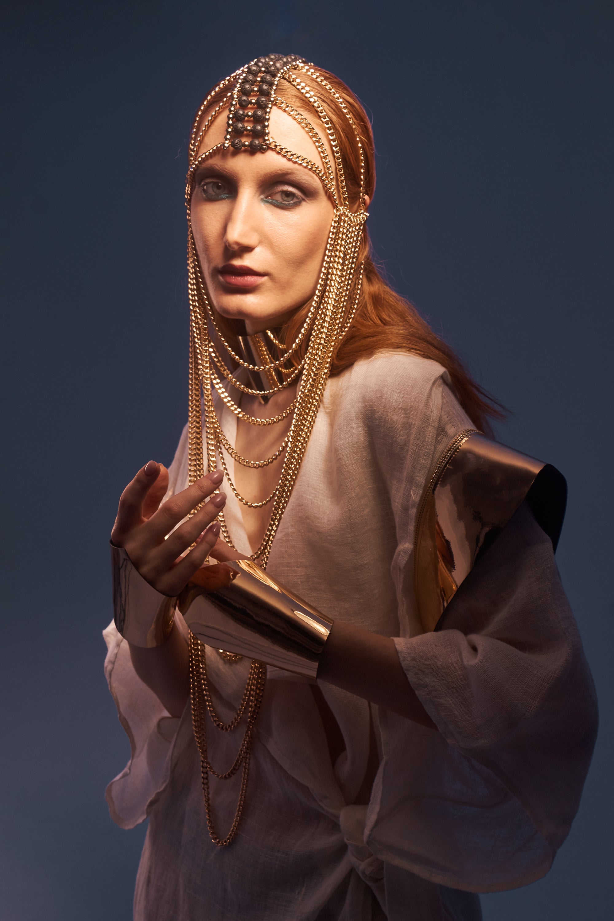 Gold chain mask with lava stone